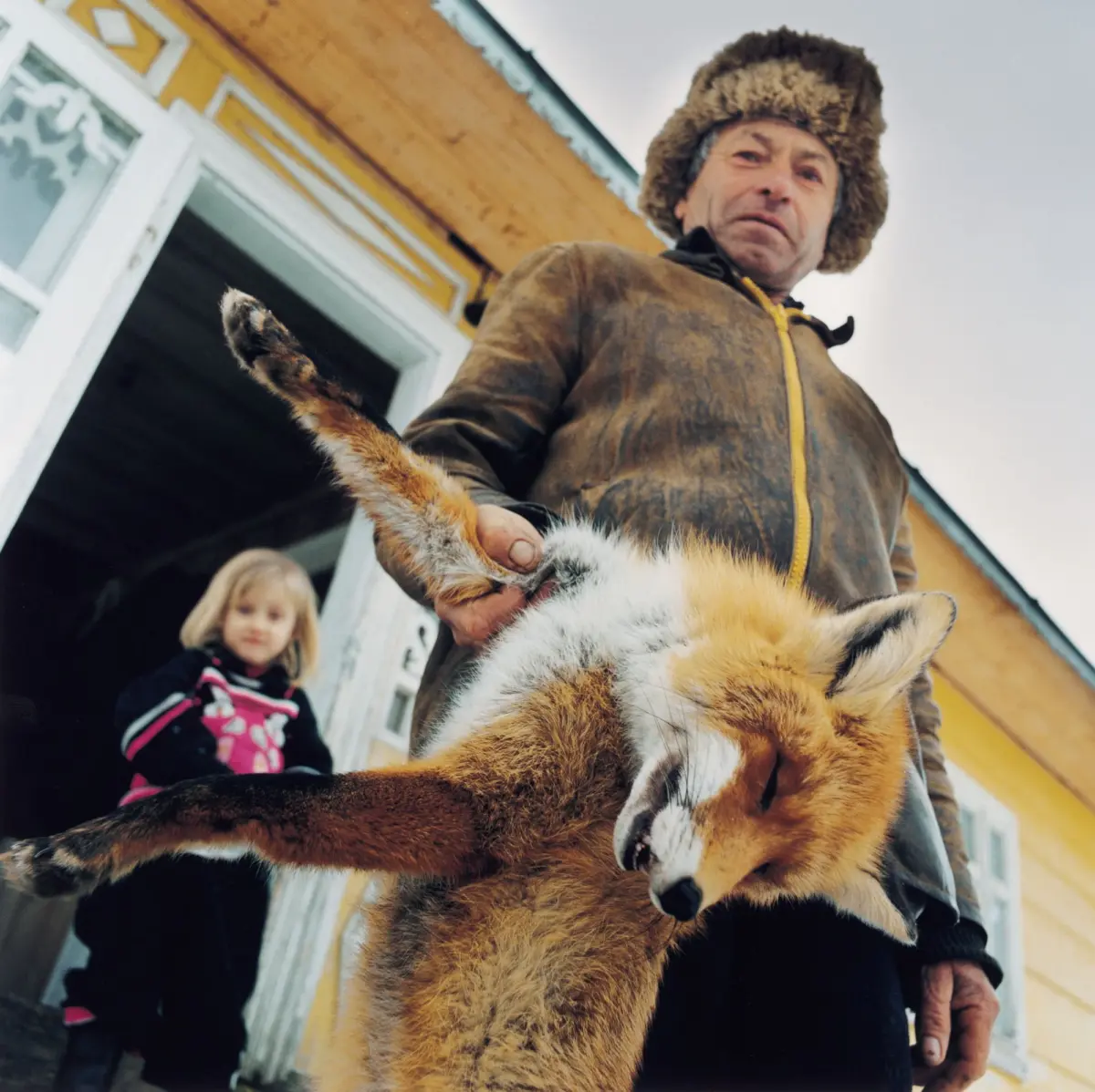 Ivan Selenchuk with his granddaughter Halyna and a trapped fox in Dzembronja