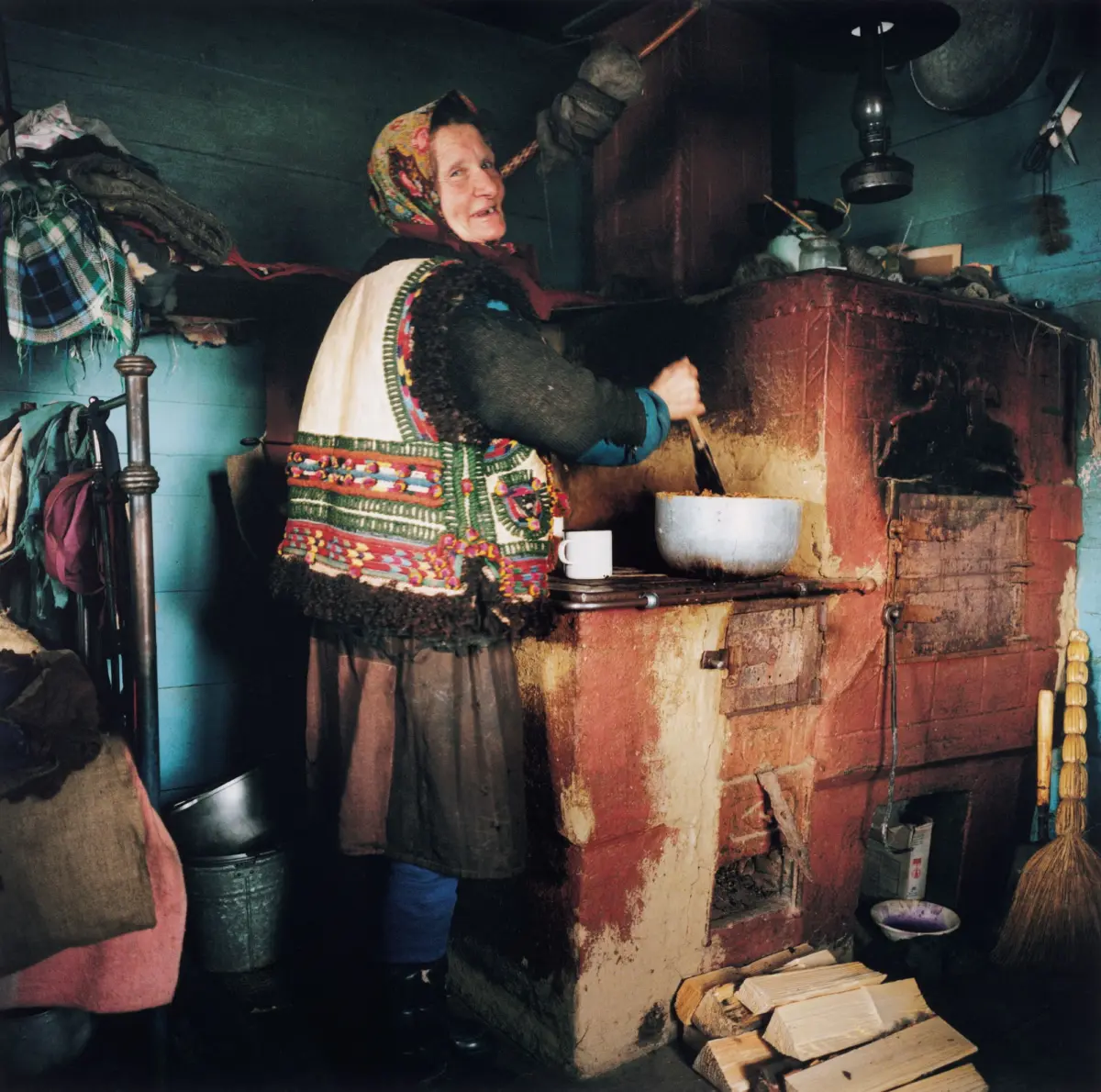 Hutsul Anna Selenchuk at the hearth in her hut in the village of Dzembronja