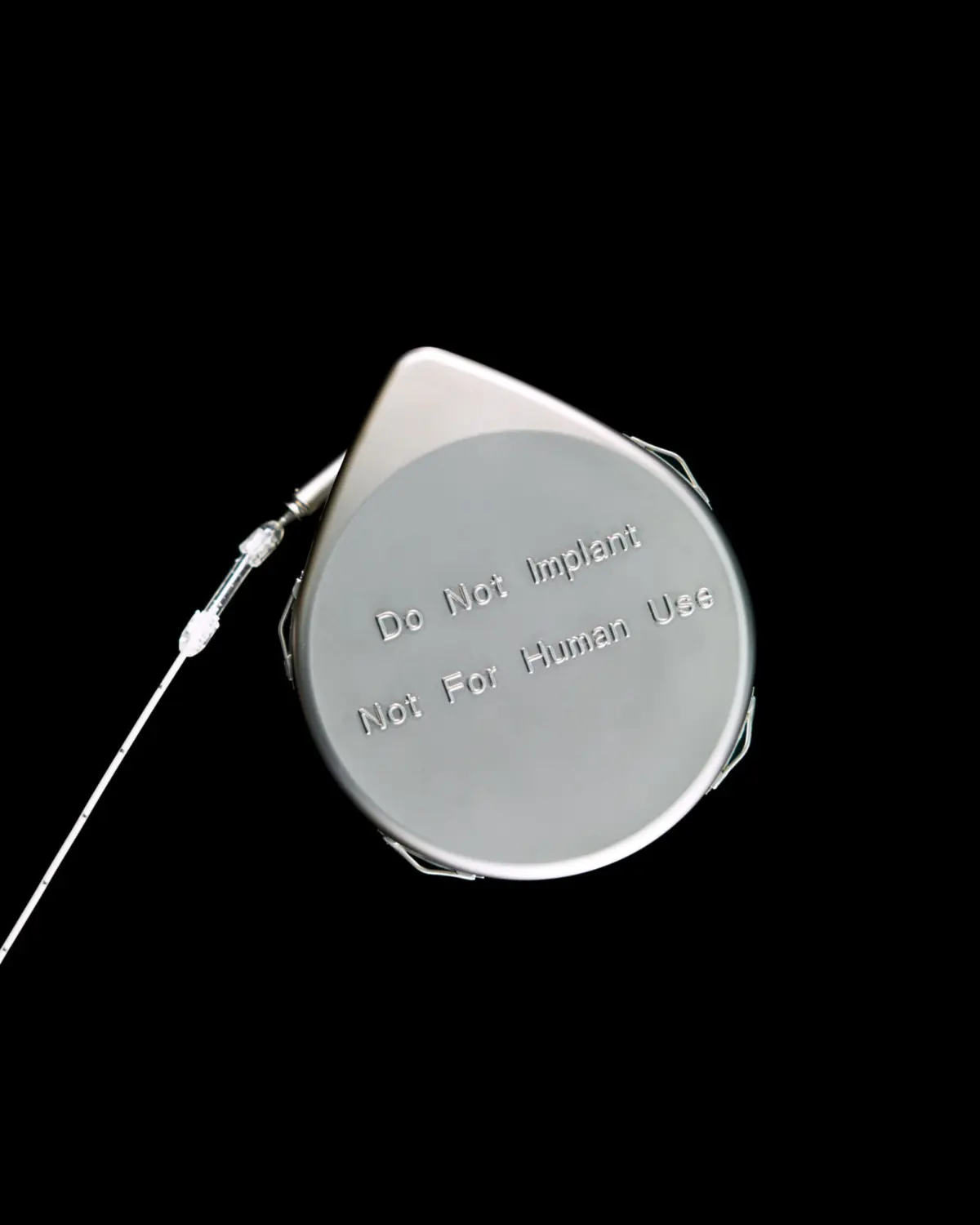Demonstration dummy of SynchroMed II Programmable Infusion Pump, used for intrathecal drug delivery. Medtronic, Inc.